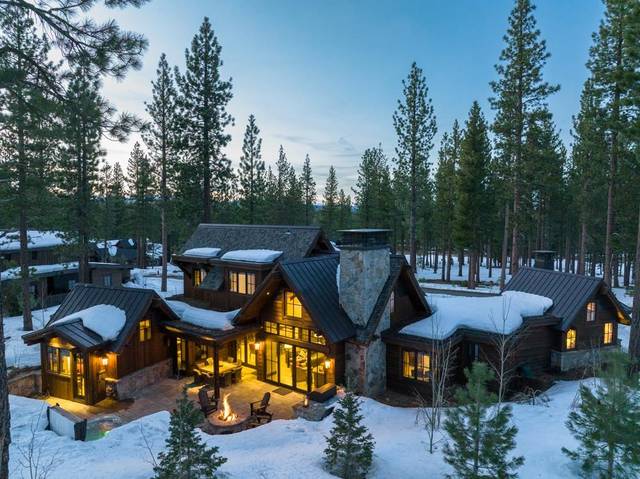 home for sale in Martis camp surrounded by pine with snow.
